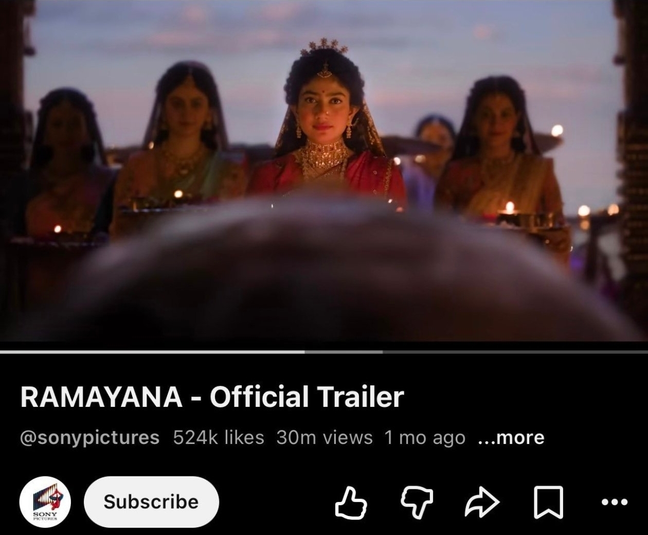 Official theatrical trailer frame showing natural depth of field lens blur behind Sai Pallavi